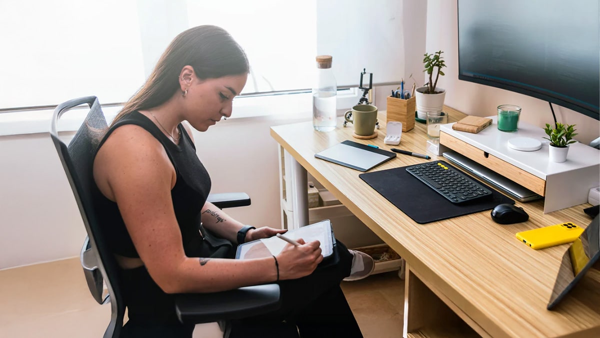 Fit woman at workdesk