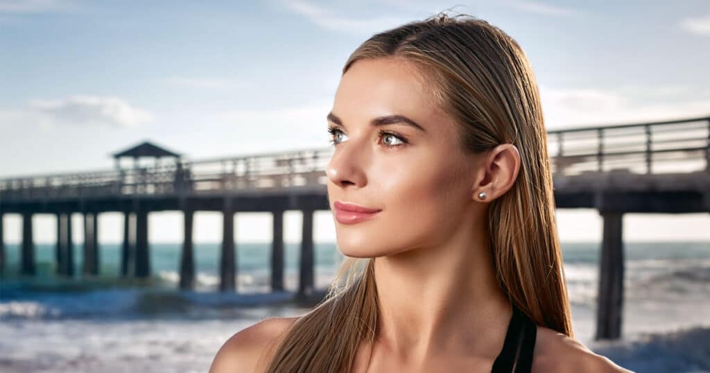 Healthy young woman at pier