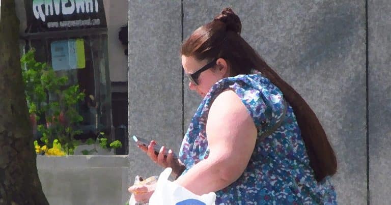 Morbidly obese woman on the phone